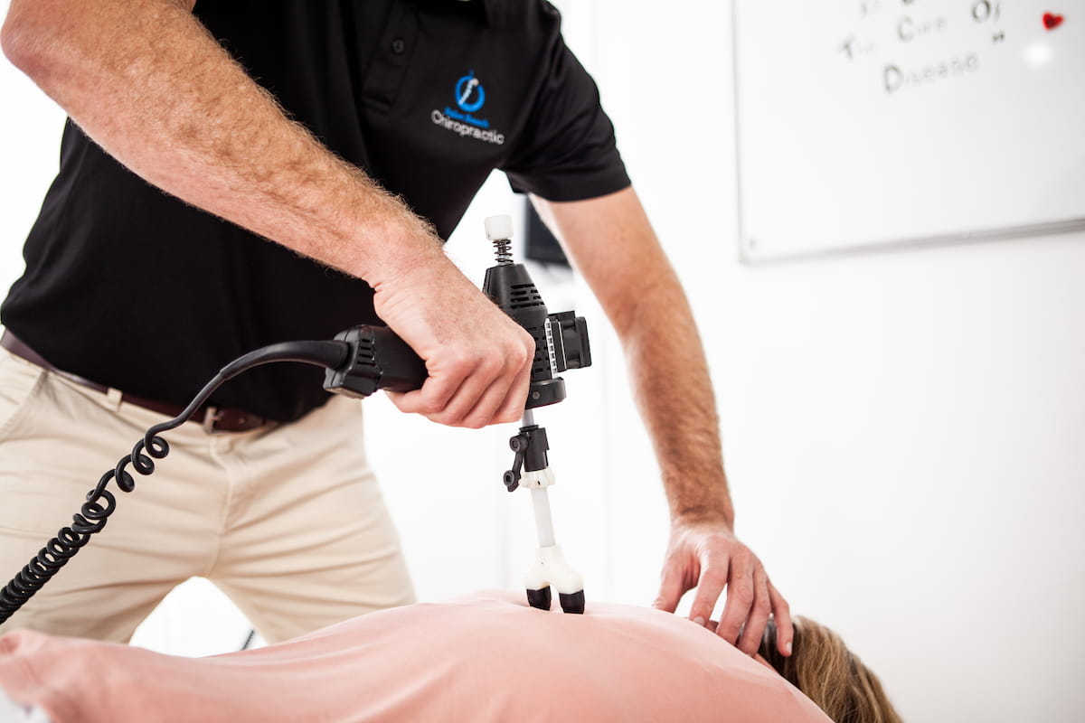 Arthrostim instrument adjustment at Palm Beach Chiropractic Gold Coast